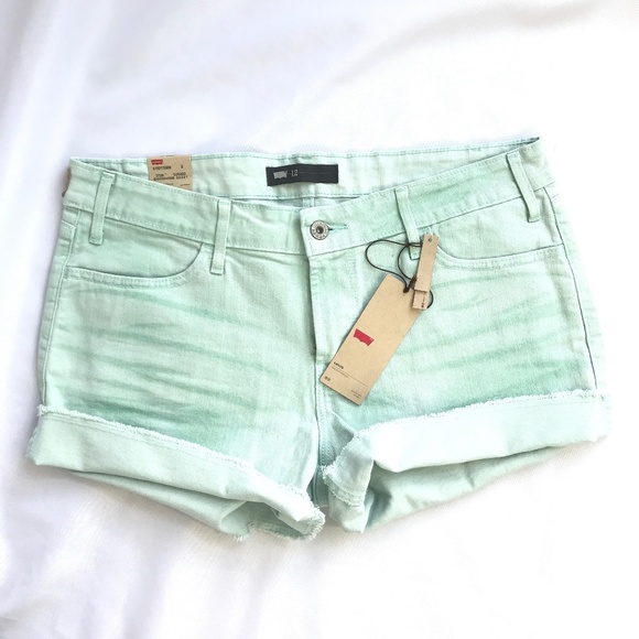 green levi shorts